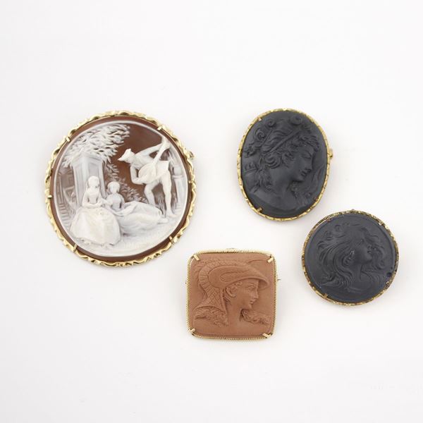 FOUR GOLD, SILVER, LAVA STONE AND SHELL BROOCHES
