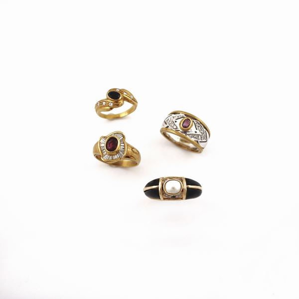 FOUR DIAMOND, ONYX AND GOLD RINGS