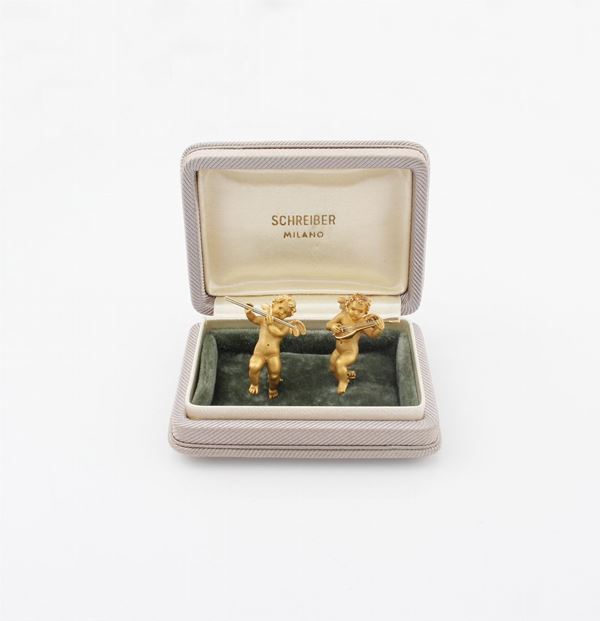 PAIR OF GOLD BROOCHES