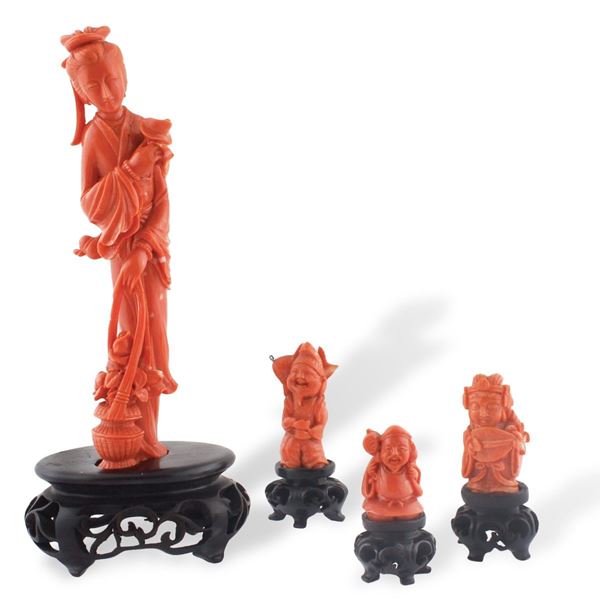 FOUR CORAL STATUES