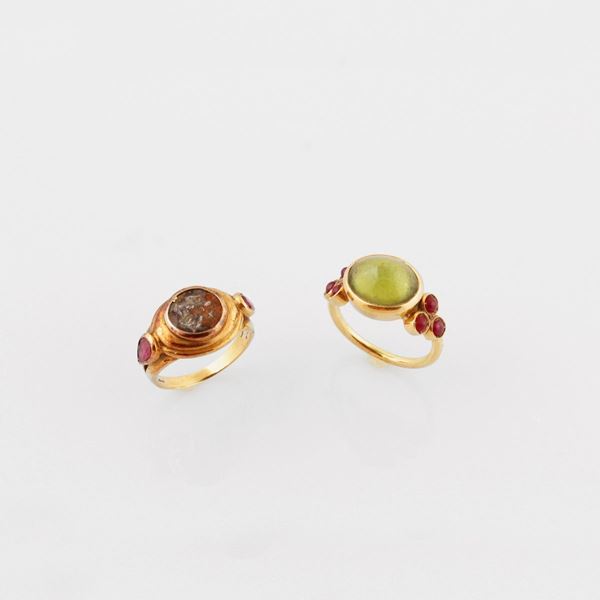 TWO PERIDOT, RUBY, GOLD AND SILVER RINGS