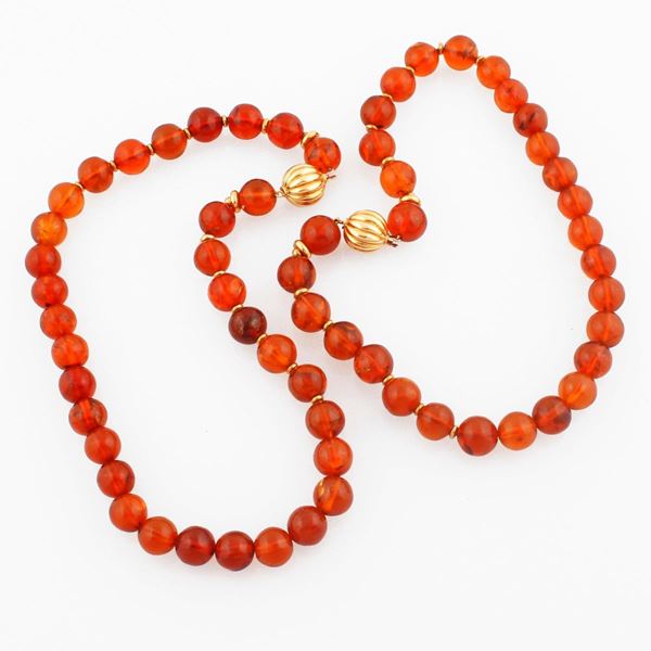 PAIR OF AMBER AND GOLD NECKLACES