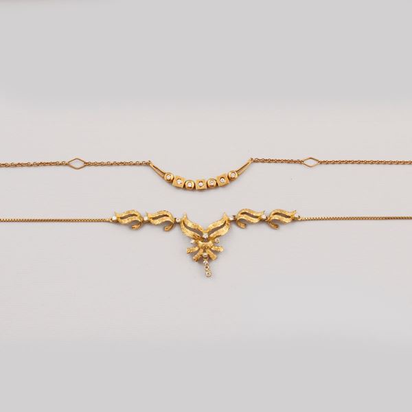 TWO DIAMOND AND GOLD NECKLACES