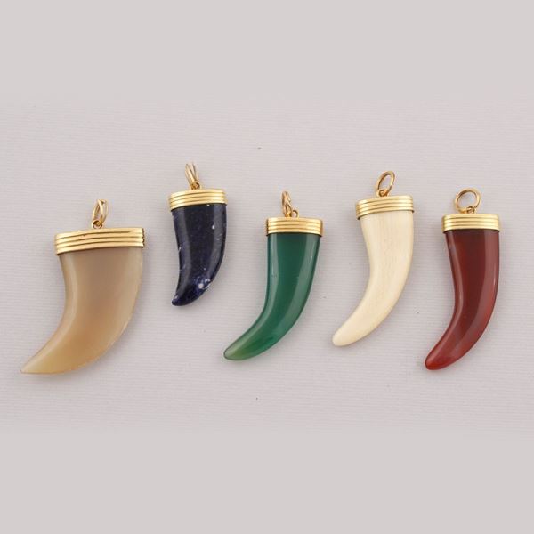 FIVE CARNELIAN, SODALITE, QUARTZ, HORN AND GOLD PENDANTS