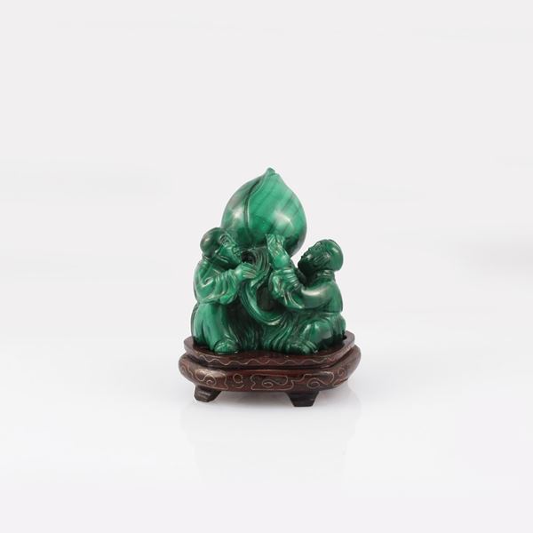 MALACHITE SCULPTURE WITH WOODEN BASE
