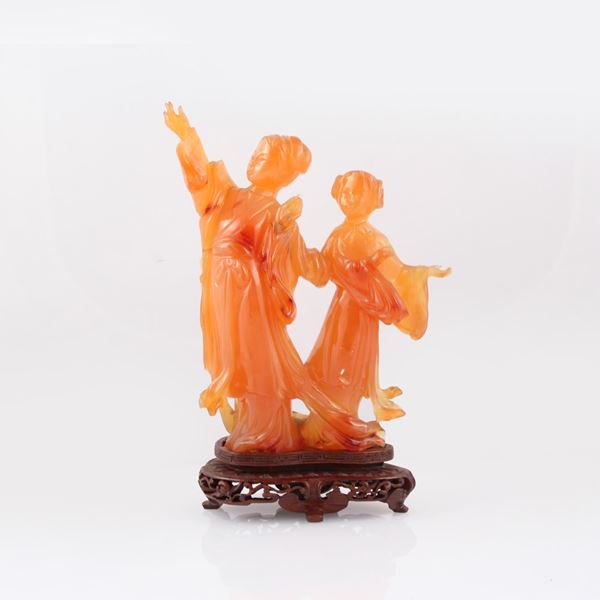 CARNELIAN SCULPTURE WITH WOODEN BASE