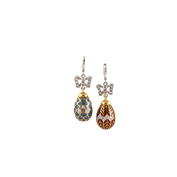 TWO 18KT GOLD PENDANTS WITH ENAMEL AND DIAMONDS