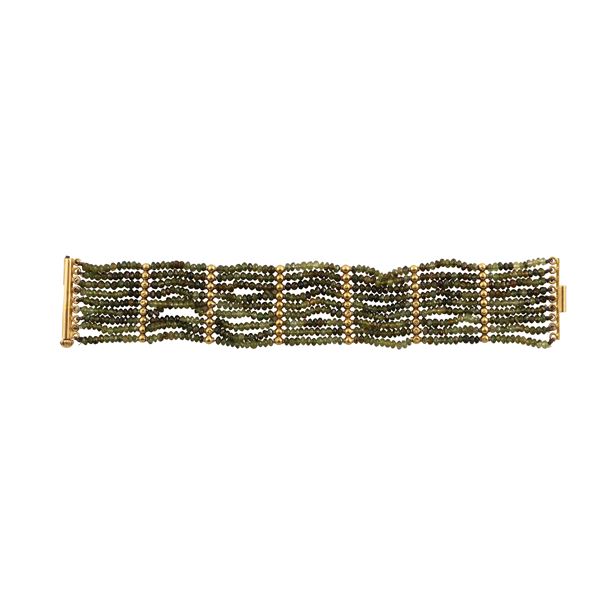 18KT GOLD, PERIDOT AND TURMALINE BRACELET 