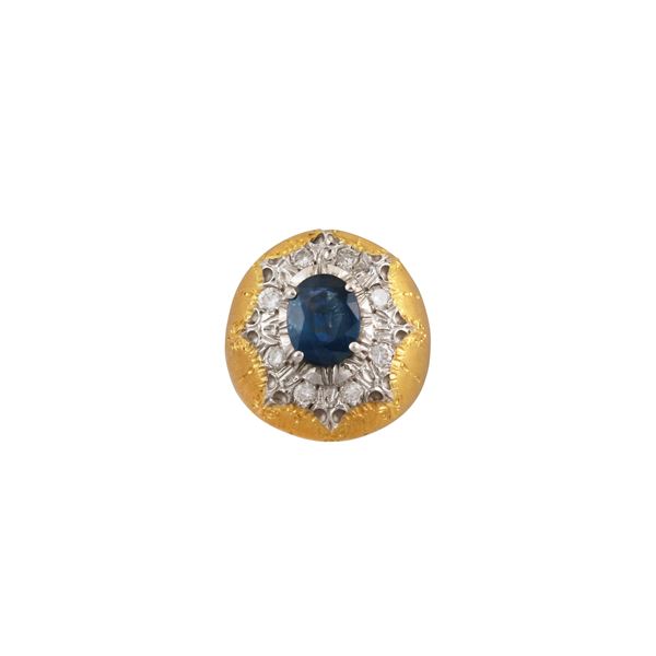 18KT GOLD SAPPHIRE AND DIAMONDS RING