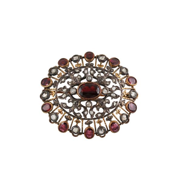 GOLD, SILVER, ROSE CUT DIAMONDS AND GARNETS BROOCH