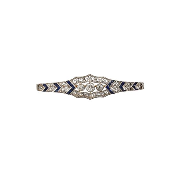 PLATINUM, 18KT GOLD, DIAMONDS AND SAPPHIRES BROOCH