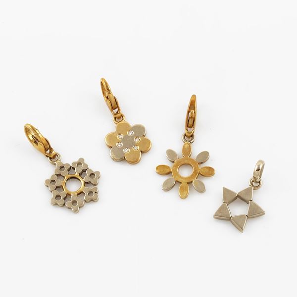 * LOT OF FOUR PENDANTS. 18 KT GOLD AND DIAMONDS