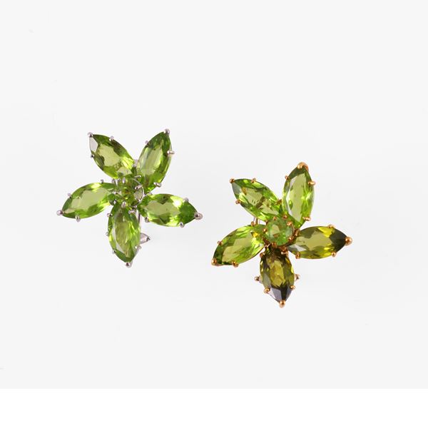 * A pair of earrings: one in 18KT yellow and white gold with peridots, the other in 18KT white gold with green tourmalines