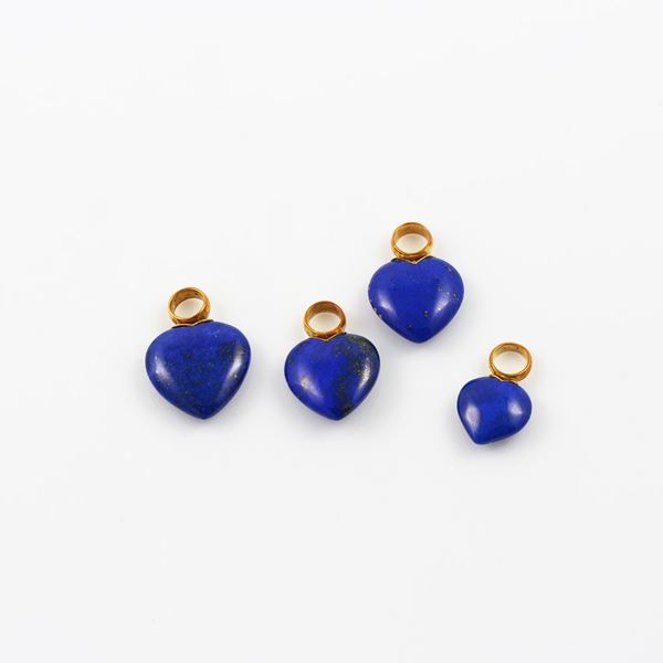 * LOT OF FOUR 18KT GOLD AND LAPISLAZULI PENDANTS