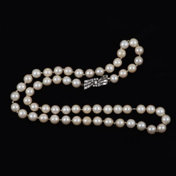 A CULTURED PEARL STRAND WITH 18KT GOLD AND DIAMONDS (two missing) CLASP