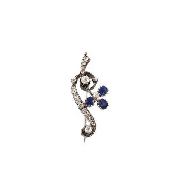 18KT GOLD, SILVER, SAPPHIRES AND DIAMONDS BROOCH