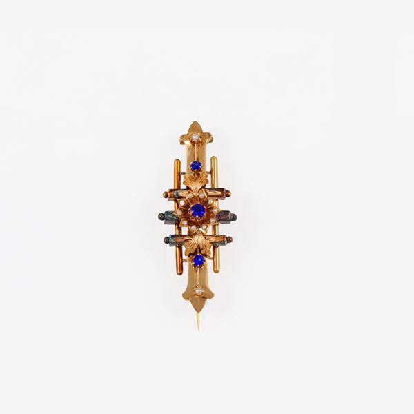 18KT GOLD AND SYNTHETIC GEMS BROOCH