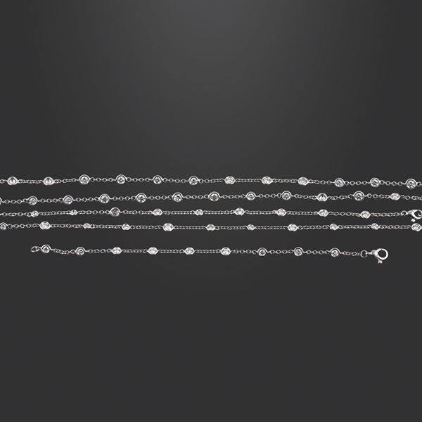 18KT GOLD AND DIAMONDS NECKLACE. CONVERTIBLE TWO NECKLACES/BRACELET