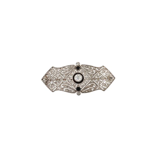PLATINUM, 18KT GOLD, DIAMONDS (one missing) AND ONYX DECO BROOCH