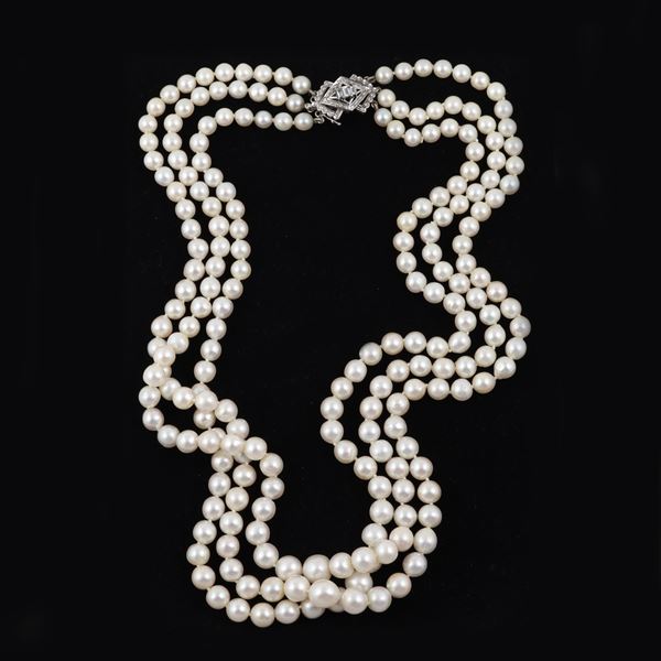 A CULTURED PEARL STREND WITH 18KT GOLD AND DIAMONDS CLASP