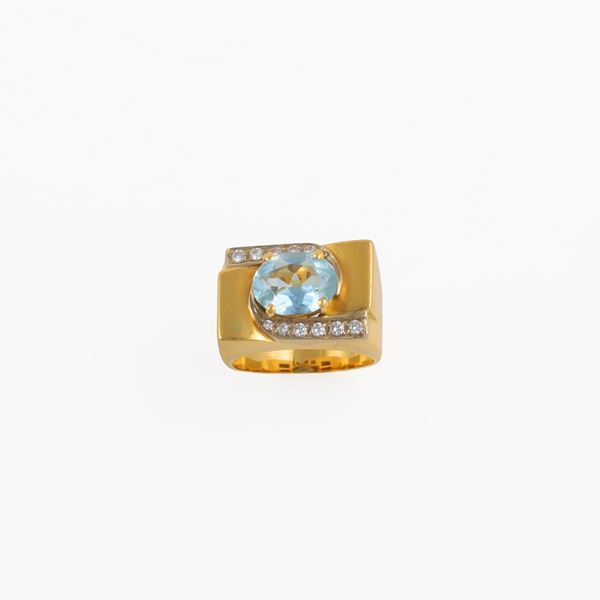 18KT GOLD, AQUAMARINE AND DIAMONDS (one missing) RING