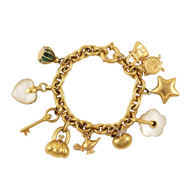 18KT GOLD AND "CHARMS" BRACELET