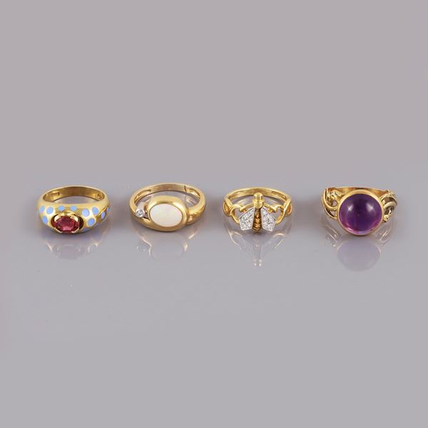 18KT GOLD LOT OF FOUR RINGS WITH TOURMALINE, ENAMEL, AMETHYST, OPAL AND DIAMONDS