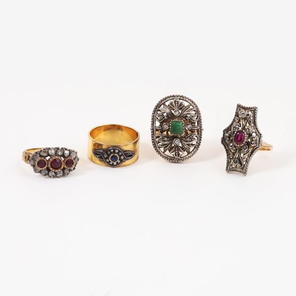 18KT GOLD ANE SILVER LOT OF FOUR RINGS WITH RUBIES, EMERALD, SAPPHIRE AND ROSE CUT DIAMONDS