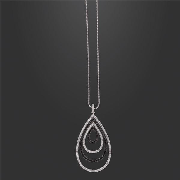 18KT GOLD AND COLORLESS AND BLACK DIAMONDS PENDANT WITH CHAIN