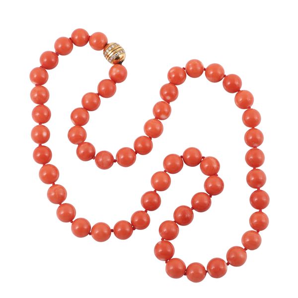 ~ A SINGLE CORAL STRAND WITH 18KT GOLD AND DIAMONDS CLASP