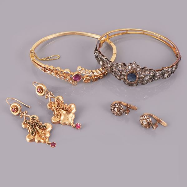18KT GOLD, 14KT GOLD AND SILVER LOT OF TWO BRACELETS AND TWO PAIR OF EARRINGS WITH DIAMONDS AND GEMS (missings)
