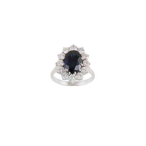 18KT GOLD, SAPPHIRE AND DIAMONDS RING