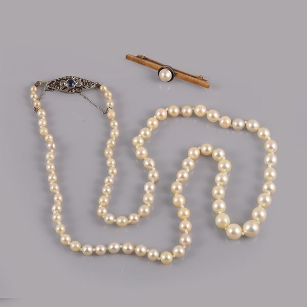 A PEARL NECKLACE WITH PLATINUM AND GOLD CLASP. A GOLD, SILVER AND PEARL BROOCH