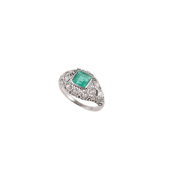 PLATINUM, EMERALD AND DIAMONDS RING
