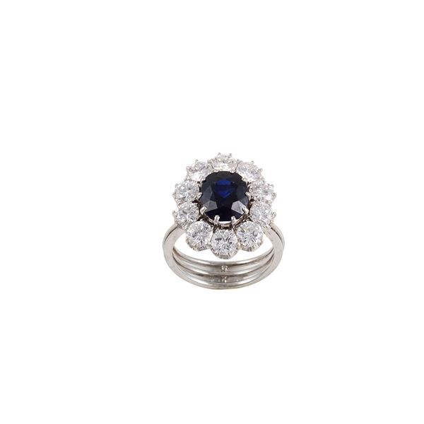 PLATINUM, SAPPHIRE AND DIAMONDS RING