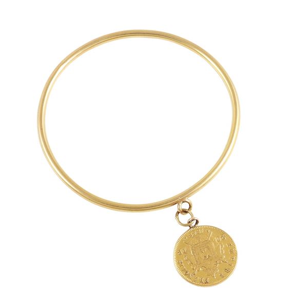 18KT GOLD BANGLE WITH GOLD COIN