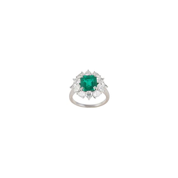 PLATINUM, EMERALD AND DIAMONDS RING