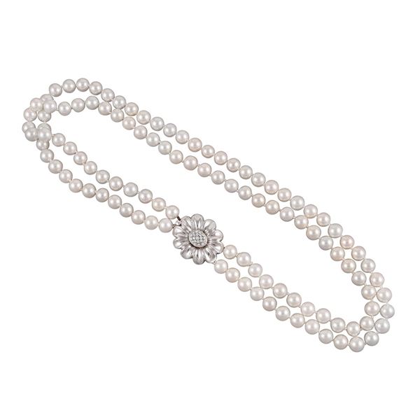 A TWO STRAND CULTURED PEARL NECKLACE WITH 18KT GOLD AND DIAMOND CLASP