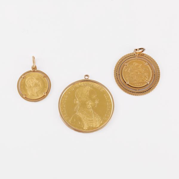 LOT OF THREE GOLD COIN PENDANTS SET IN 18KT GOLD