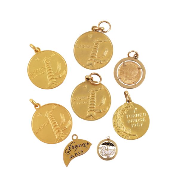 LOT OF EIGHT 18KT GOLD MEDALS, ONE MOUNTED WITH A COIN