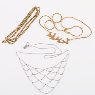 Tre catenine in oro giallo e oro bianco