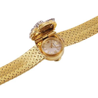 Bracciale-orologio in oro giallo e bianco con brillanti
