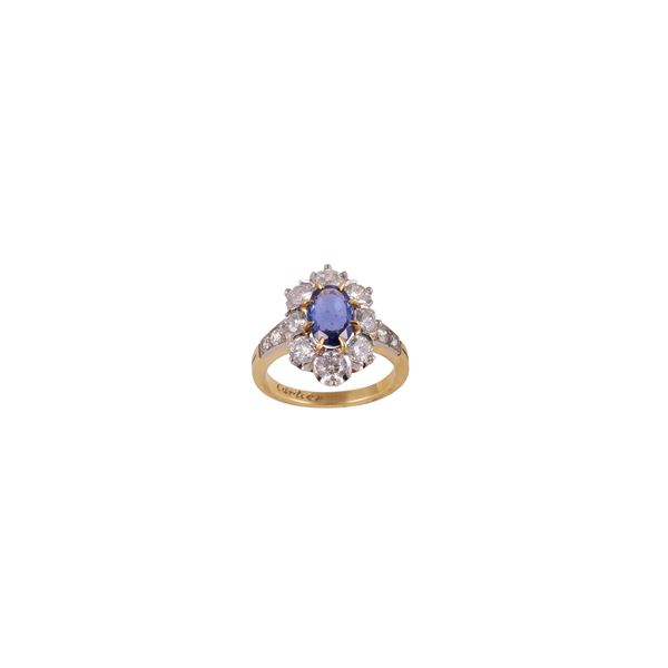 18KT GOLD AND PLATINUM RING WITH SAPPHIRE AND DIAMONDS
