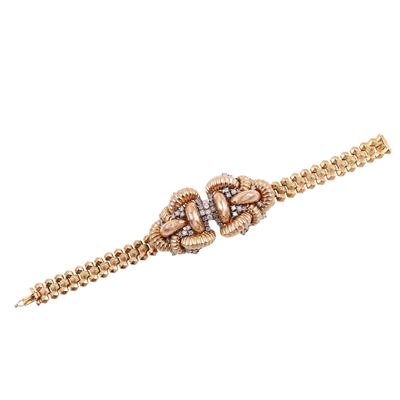 Bracciale in oro rosa e bianco con motivi bombati e brillanti