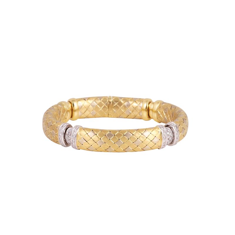 Bracciale semirigido in oro giallo e bianco con brillanti