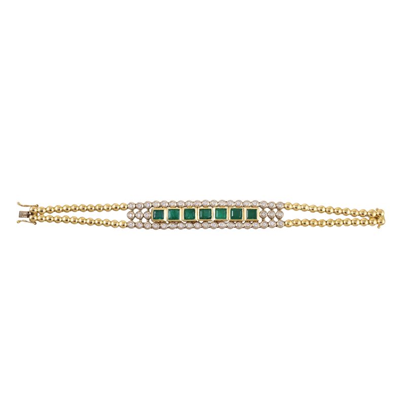 Bracciale in oro giallo e bianco con smeraldi e brillanti