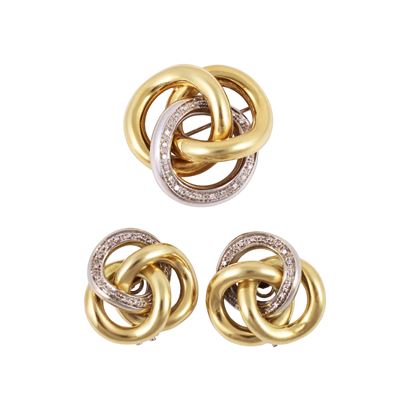 Parure in oro giallo e bianco con diamanti, composta da spilla e orecchini
