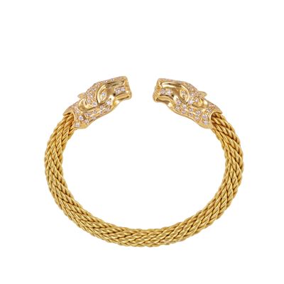 Bracciale semirigido in oro giallo con teste leonine e brillanti