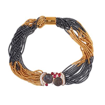 Scavia, Girocollo in oro giallo ed ematite con ornamenti in brillanti e rubini
