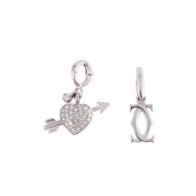 Cartier e Piaget, Due charms in oro bianco con pavé di brillanti